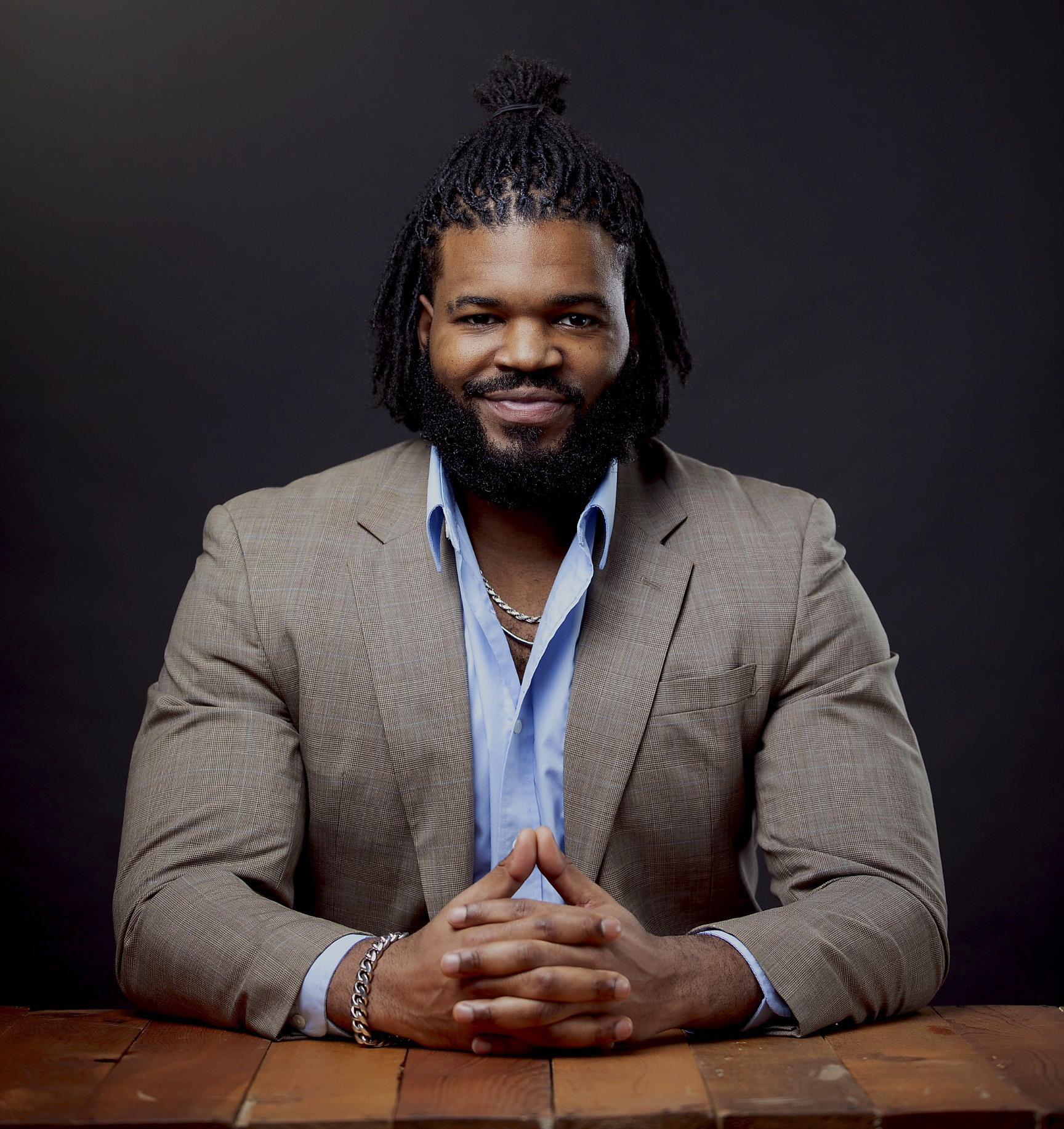 AJ seated for his professional portrait